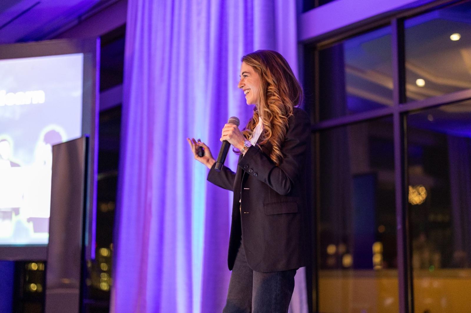 Kristin Messerli presenting the NextGen research on stage.